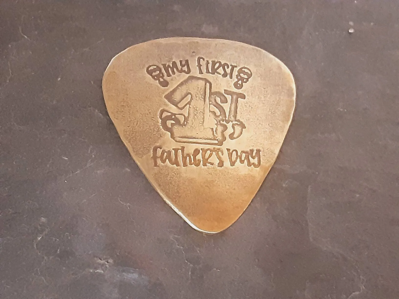 My first Fathers Day Brass Guitar Pick