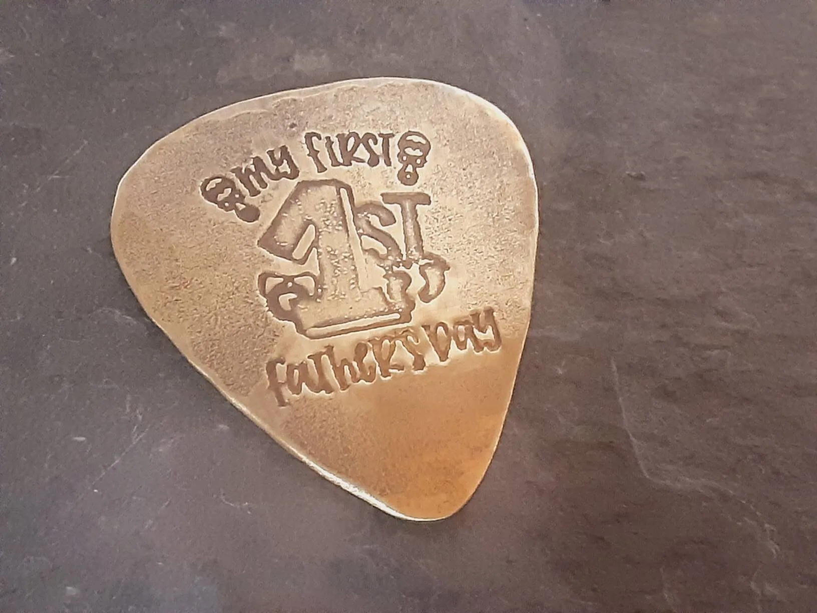 My first Fathers Day Brass Guitar Pick