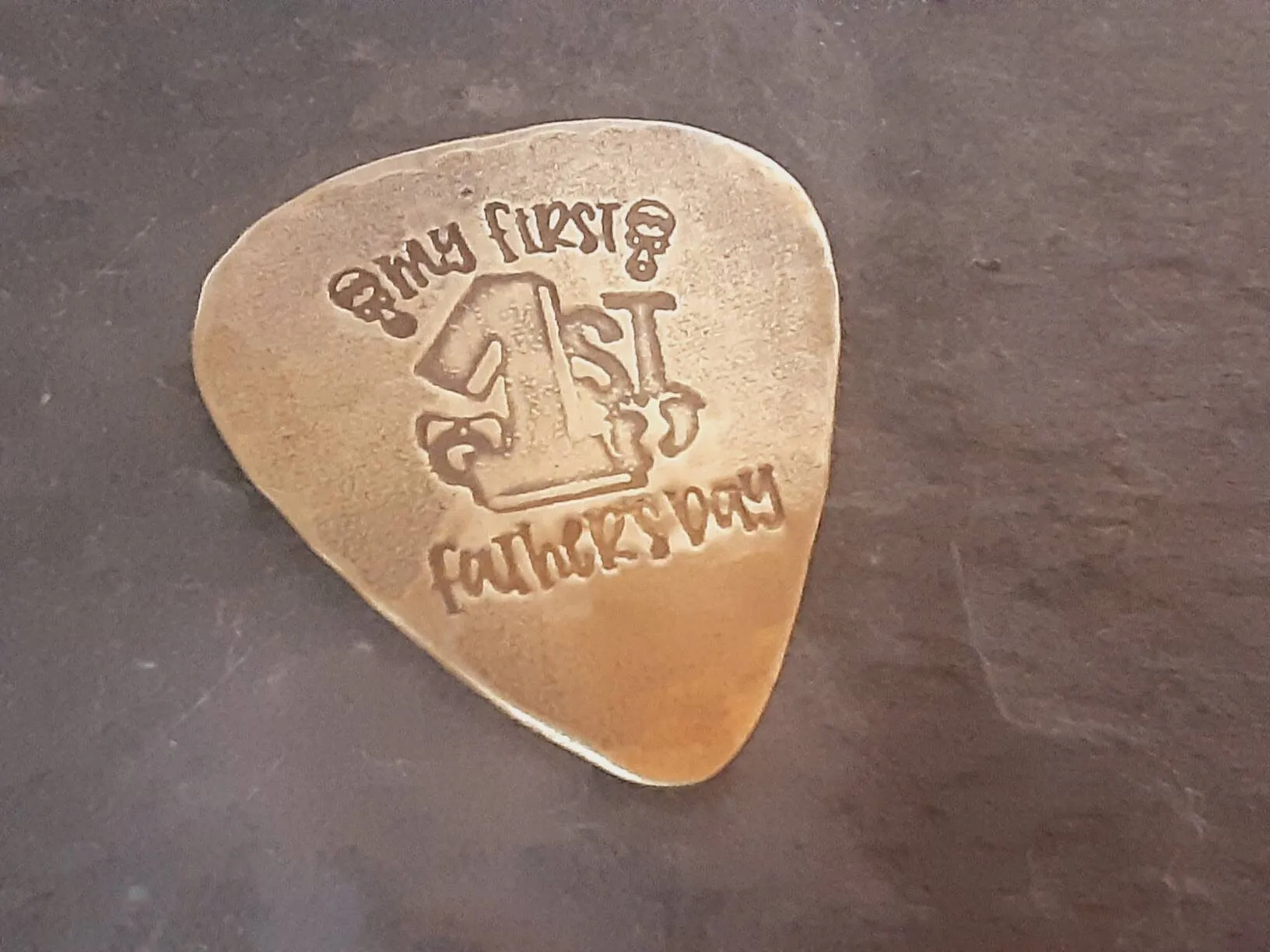 My first Fathers Day Brass Guitar Pick