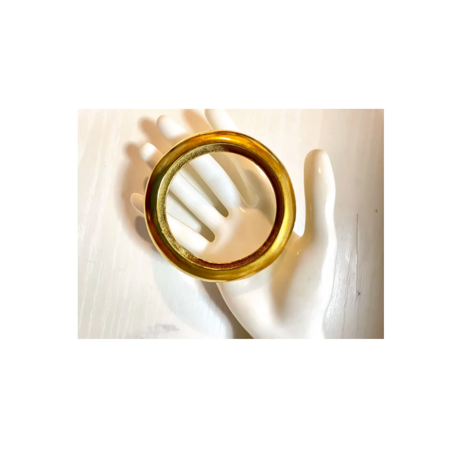 Vintage Chanel golden bangle with embossed black logo.  Must have gorgeous jewelry. 060810r1