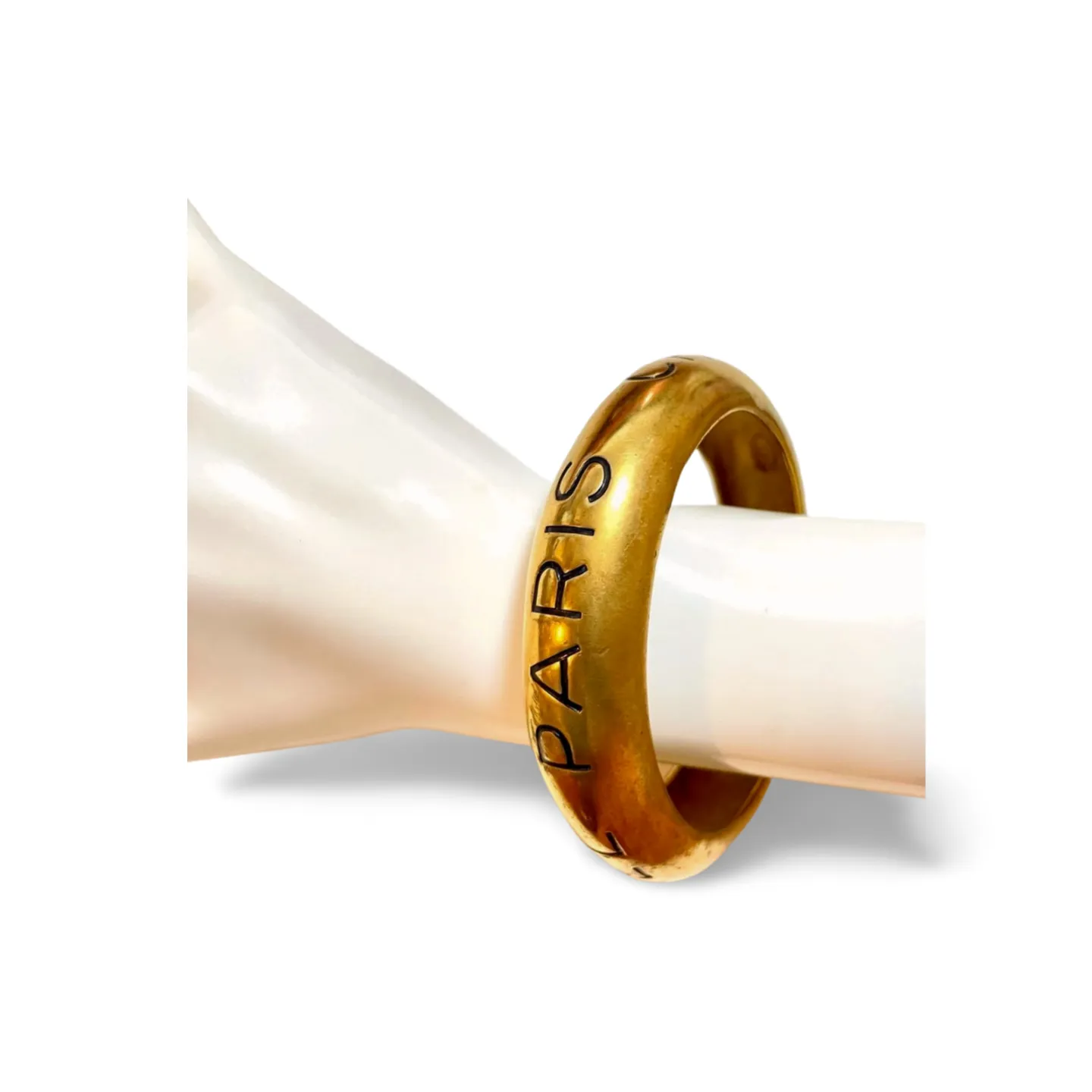 Vintage Chanel golden bangle with embossed black logo.  Must have gorgeous jewelry. 060810r1