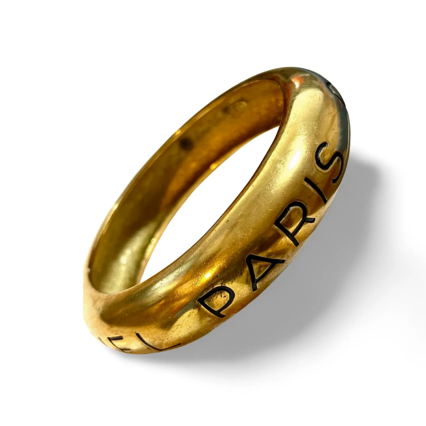 Vintage Chanel golden bangle with embossed black logo.  Must have gorgeous jewelry. 060810r1