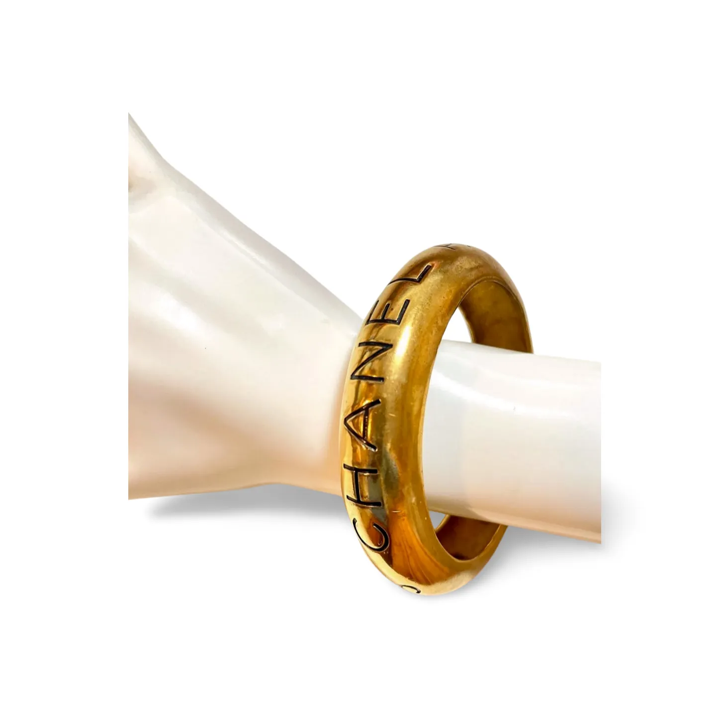 Vintage Chanel golden bangle with embossed black logo.  Must have gorgeous jewelry. 060810r1