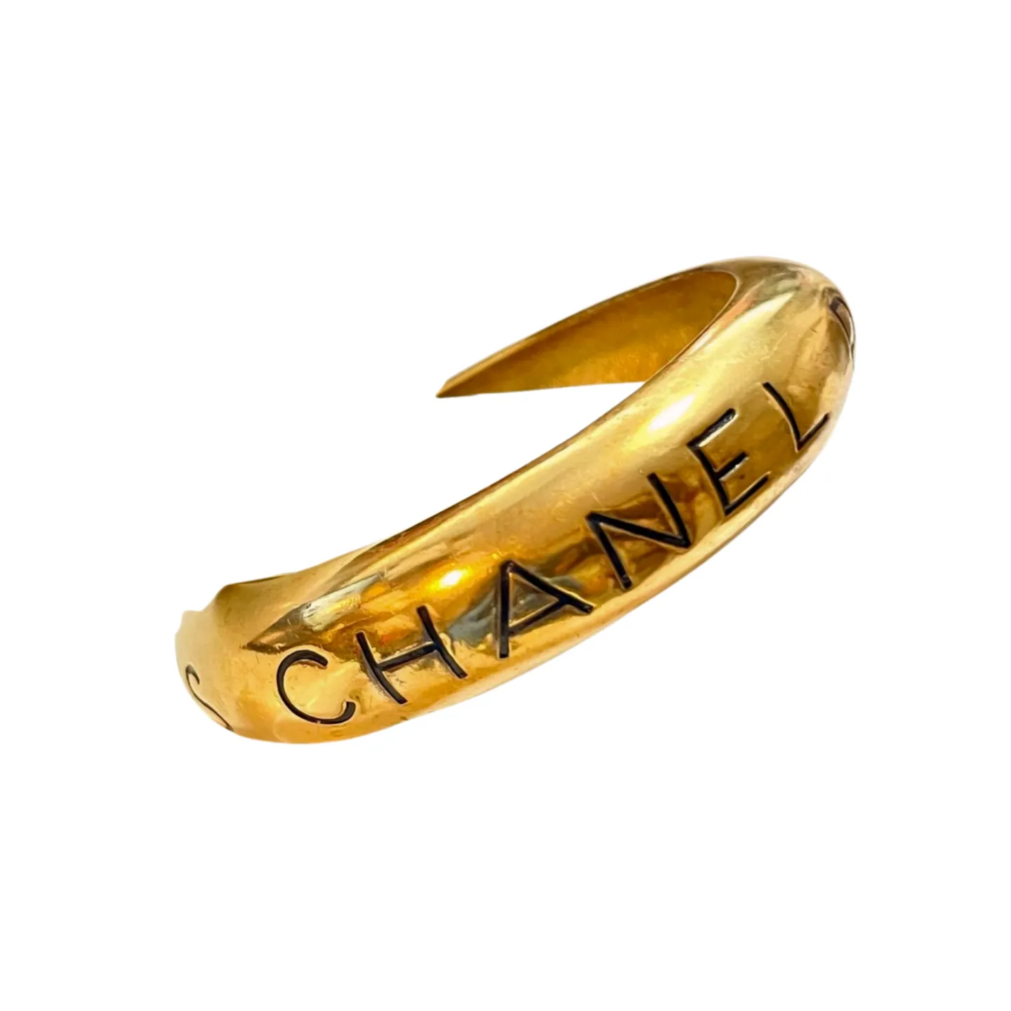Vintage Chanel golden bangle with embossed black logo.  Must have gorgeous jewelry. 060810r1