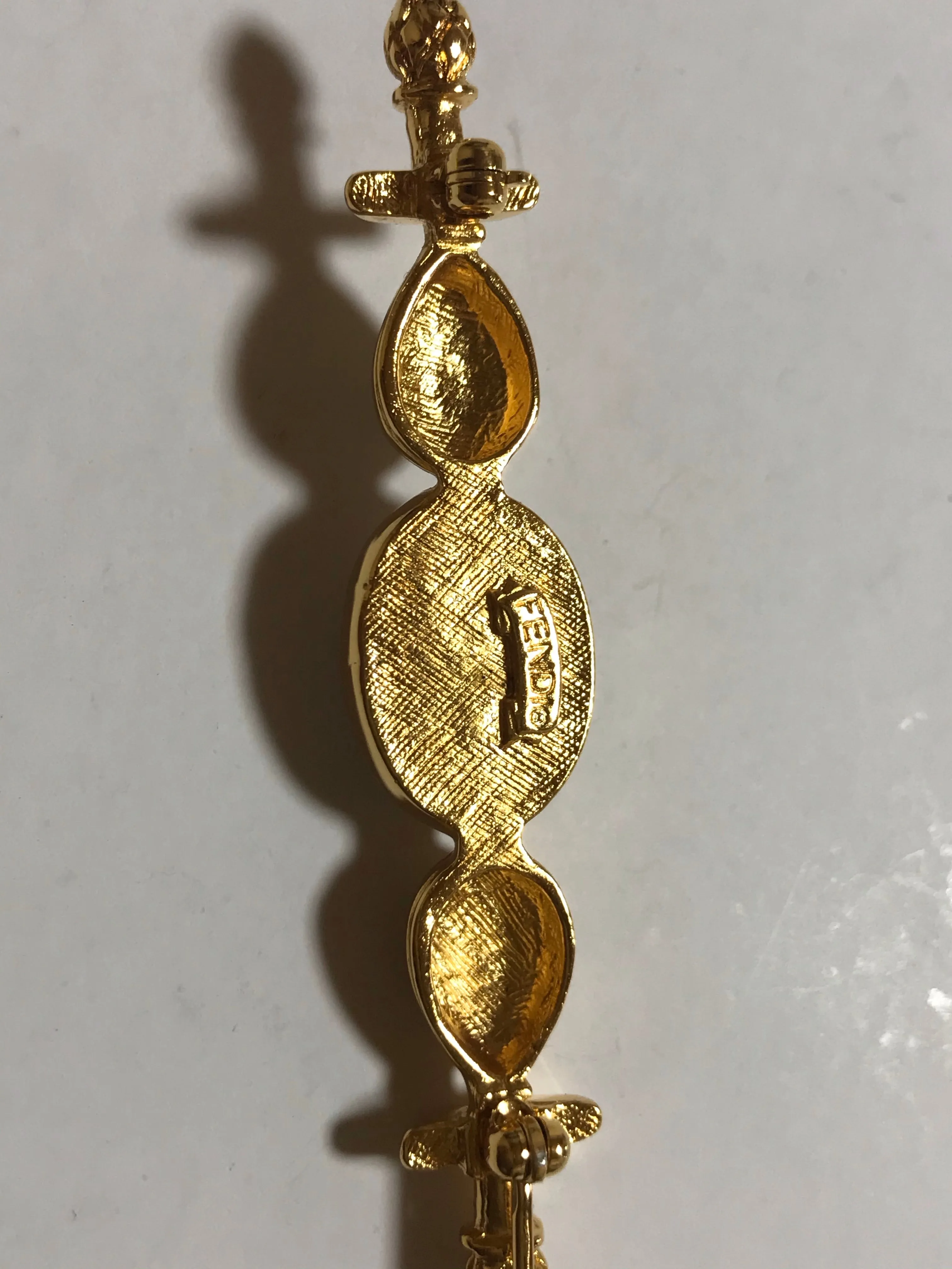 Vintage FENDI gold tone hat pin with white oval faux pearl and FF mark. Can be used as a brooch pin, jacket brooch pin too. 060926re5