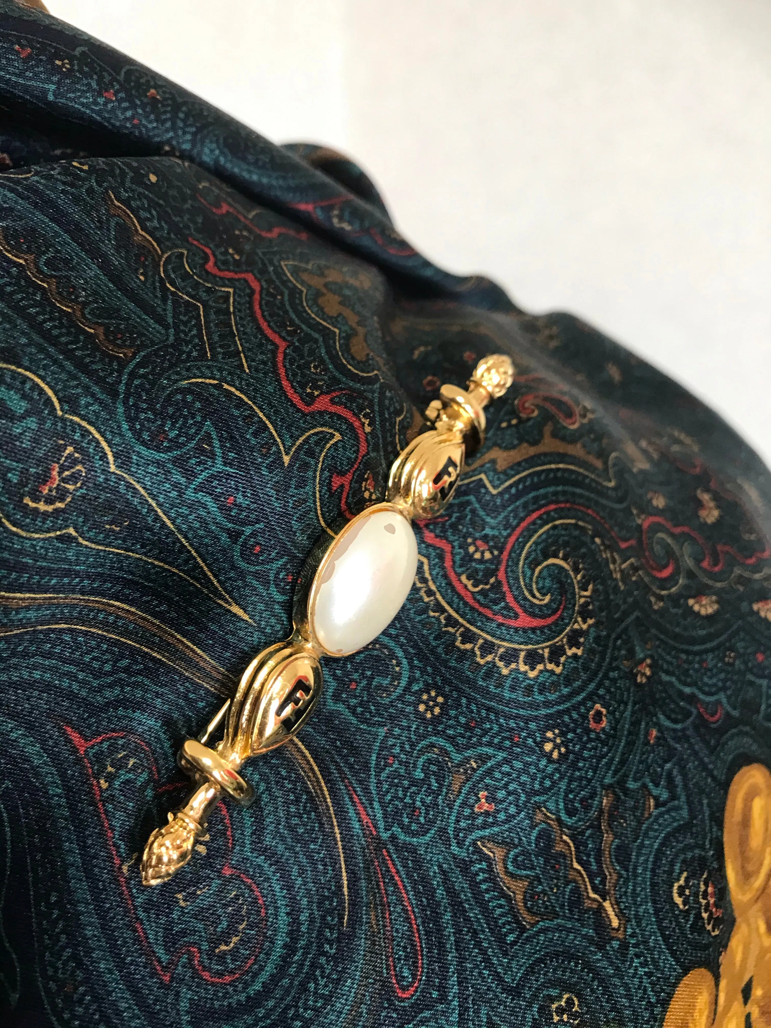 Vintage FENDI gold tone hat pin with white oval faux pearl and FF mark. Can be used as a brooch pin, jacket brooch pin too. 060926re5