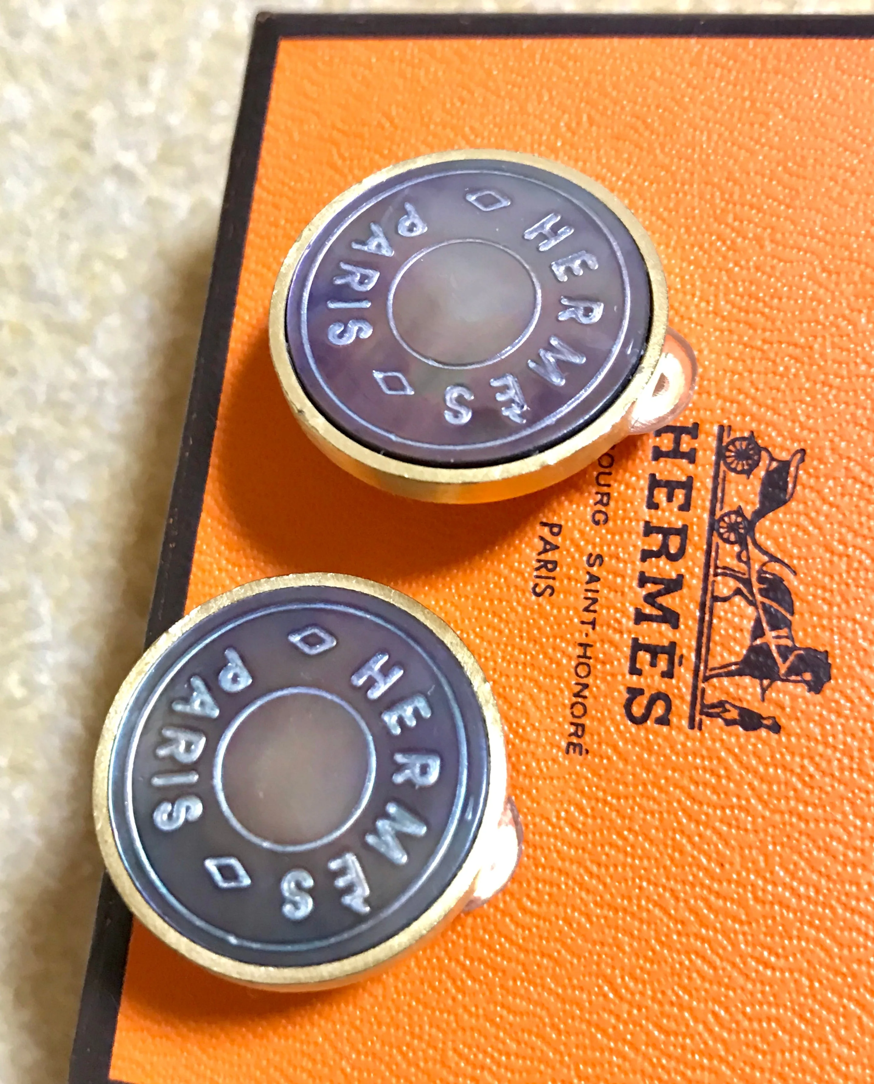 Vintage HERMES golden logo embossed genuine shell earrings. Classic jewelry piece. Bijouterie Fantaisie. Shines like aurora.