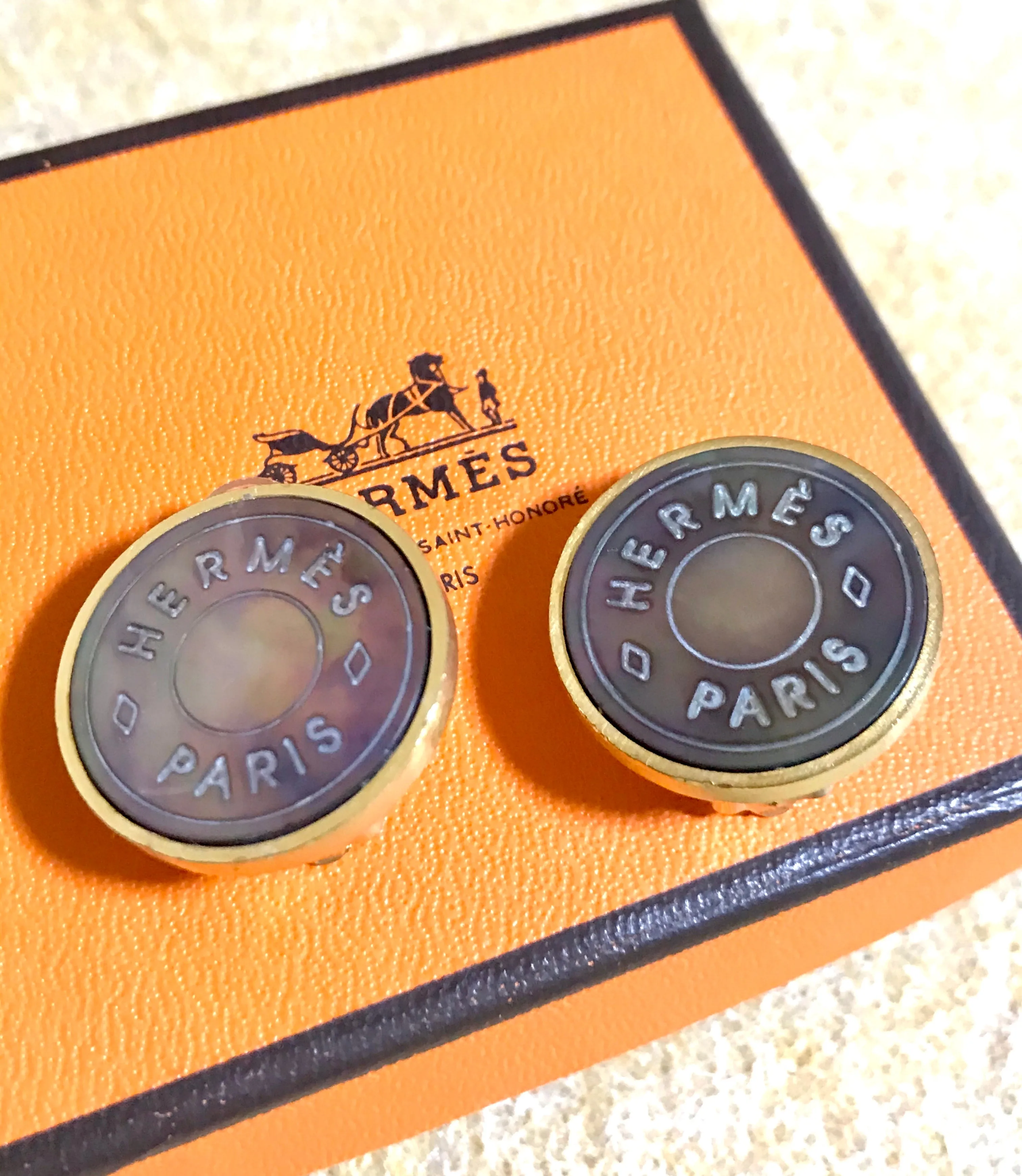 Vintage HERMES golden logo embossed genuine shell earrings. Classic jewelry piece. Bijouterie Fantaisie. Shines like aurora.